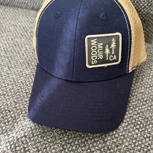 Men’s navy blue and tan mesh back trucker hat